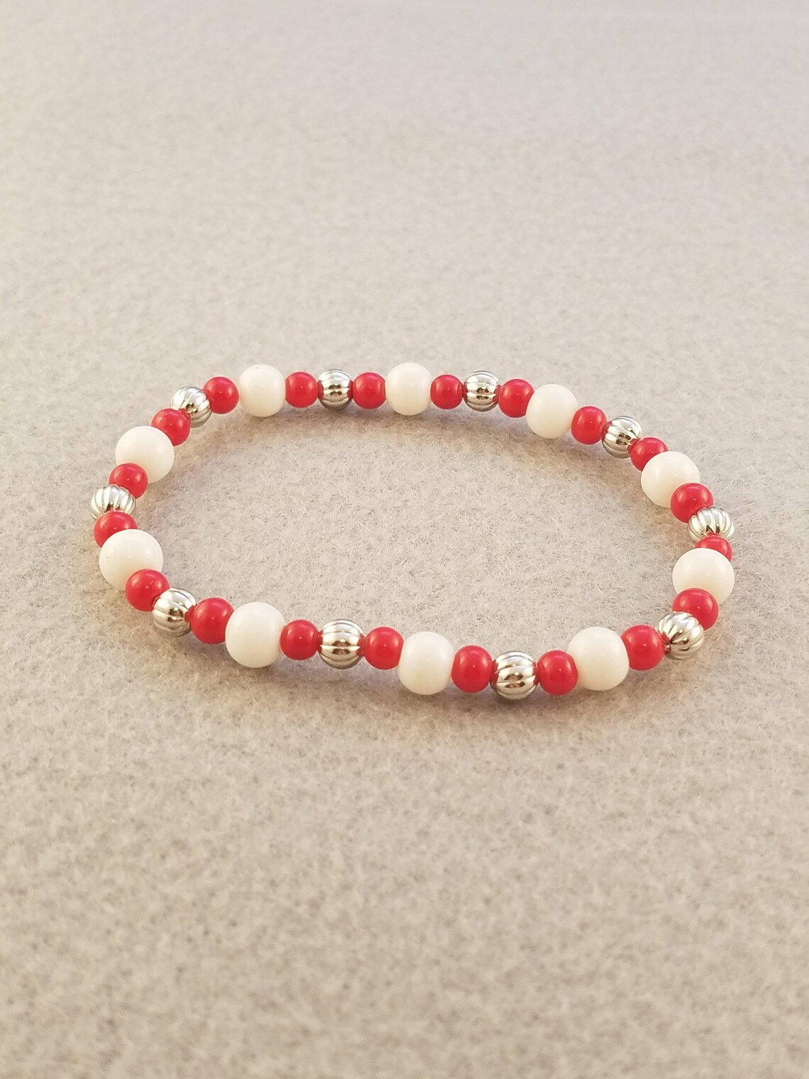 white and red bracelet