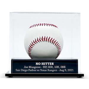 May include: A white baseball with red stitching, displayed in a clear acrylic case. The base features a black plaque with the text "NO HITTER" and details of the game: Joe Musgrove - 9IP, OER, 10K, OBB, San Diego Padres vs Texas Rangers - Aug 9, 2021.