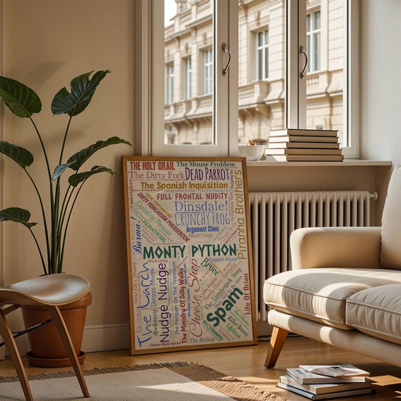 May include: A wooden framed poster with phrases from Monty Python's work, including "The Holy Grail" and "Spam". The poster is in a room with a beige sofa, a large potted plant, and a window overlooking a street.
