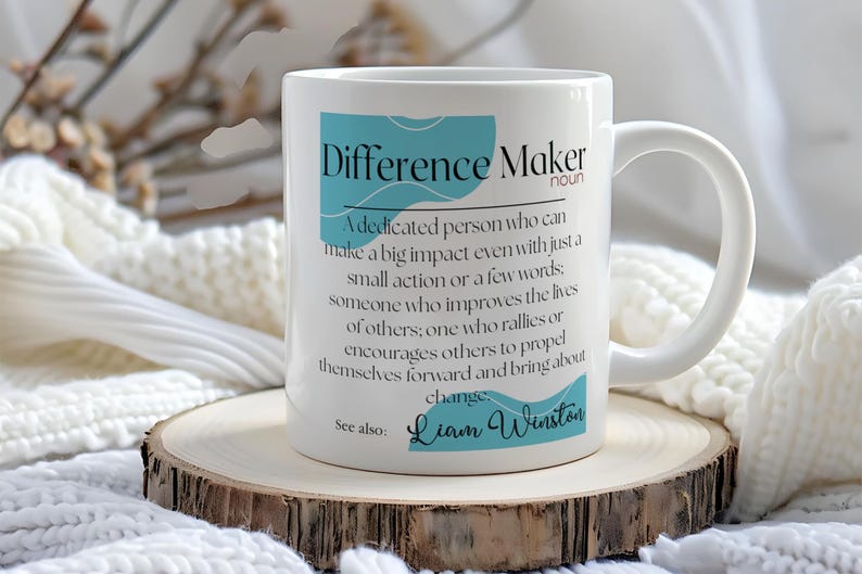 May include: White ceramic coffee mug with a blue and white design. The mug features the text "Difference Maker" with a definition and the name "Liam Winston".