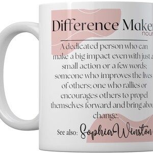 May include: White ceramic mug with a pink and white design. The mug features the text "Difference Maker" with a definition and the name "Sophia Winston".