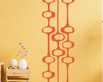 May include: A wall decal with a mid-century modern design featuring a series of connected orange ovals and lines.