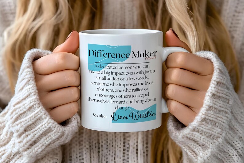 May include: White ceramic mug with a blue and white design. The mug features the text "Difference Maker" with a definition and the name "Liam Winston".