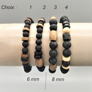 Può includere: Quattro braccialetti di perline con perline nere, marroni e color crema. I braccialetti sono esposti su una superficie di colore neutro. Il testo "Choix" e i numeri 1-4 sono visibili. I testi "6 mm" e "8 mm" sono anch'essi visibili.