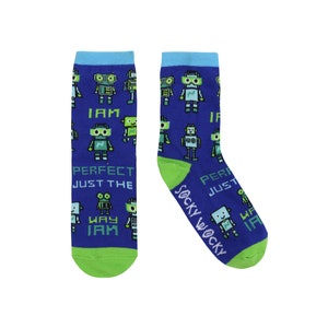 May include: A pair of blue socks with a green and blue robot pattern. The socks have the text "I am perfect just the way I am" on one sock and "Sockywacky" on the other.
