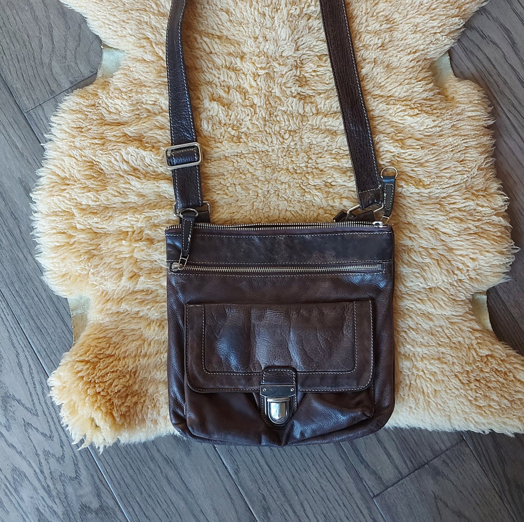 Vintage Roots leather crossbody bag, soft, worn, faded,  brown leather, long adjustable leather strap, made in Canadaj
