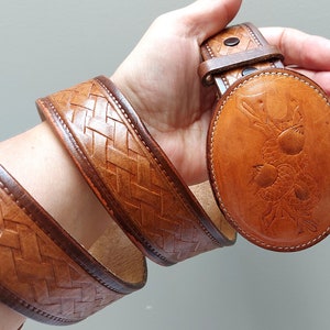 Vintage tooled brown leather belt with leather buckle, size 34, handmade, Kamloops BC Canada, acorn design braided detail, worn, marked OOAK