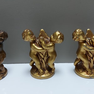 Cherub candleholders, metal art, gold paint, mixed set of 3