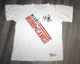 Vintage 90s Clothing University of Miami Hurricanes UM Football Men Size Large / Oversized Womens Cartoon Logo Short Sleeve College T Shirt