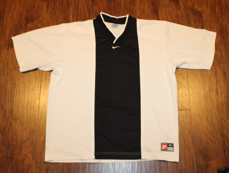 nike shirt swoosh on collar