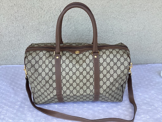Vintage Gucci Plus brown monogram duffle bag with leather trimming