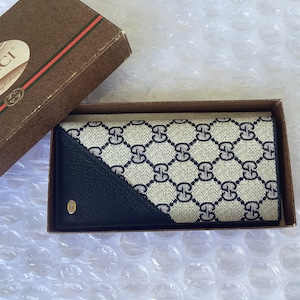 Cartera larga plegable Gucci vintage de los años 90, unisex, de lona azul, sin usar, en perfecto estado, usada.