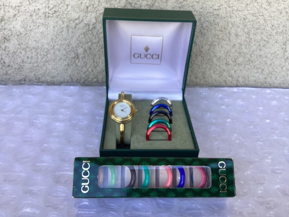 bangle watch with interchangeable bezels