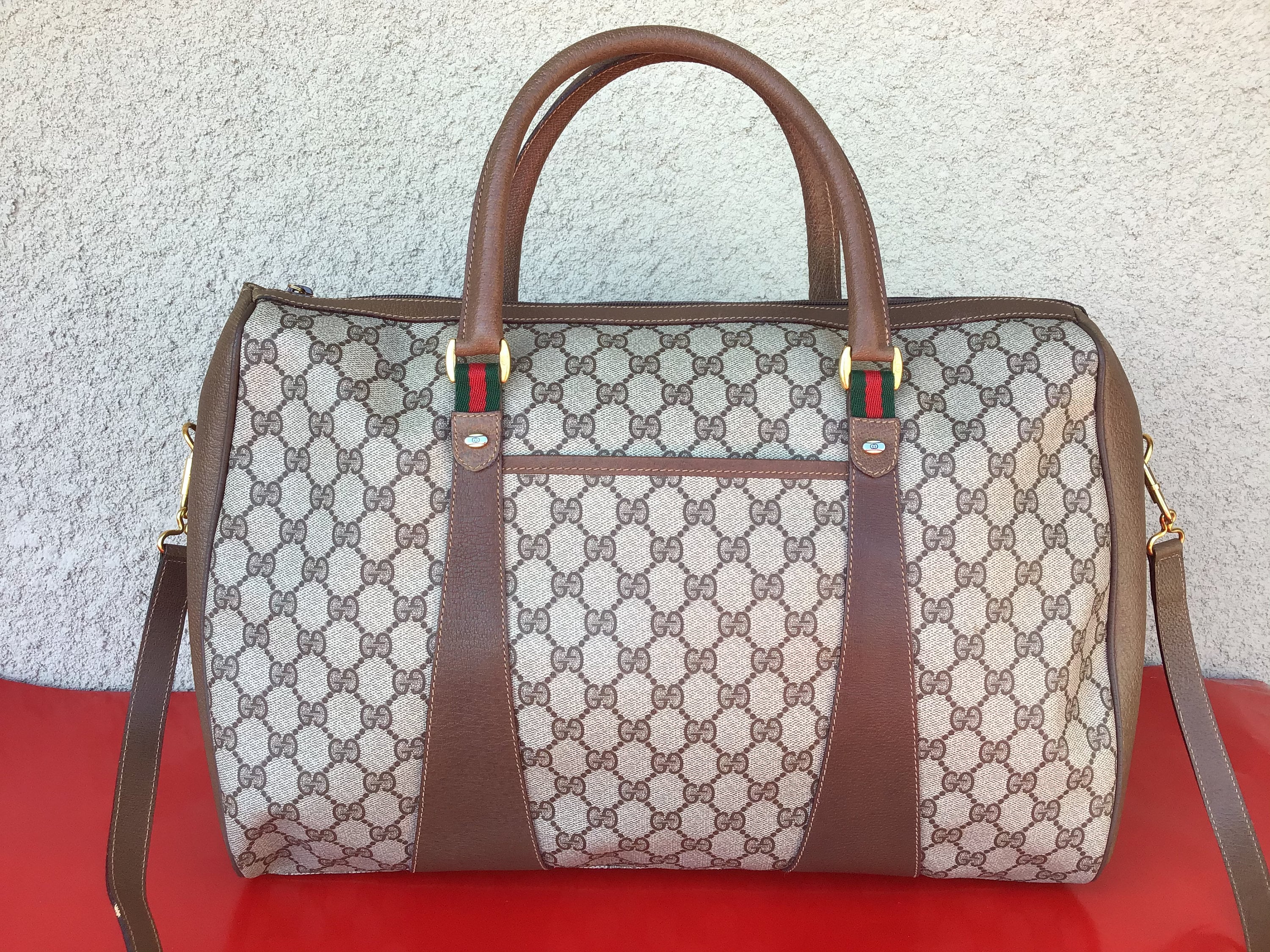 Vintage Gucci Plus brown monogram duffle bag with leather trimming and –  eNdApPi ***where you can find your favorite designer  vintages..authentic, affordable, and lovable.