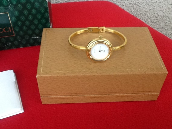 bangle watch with interchangeable bezels