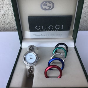 silver gucci bezel watch