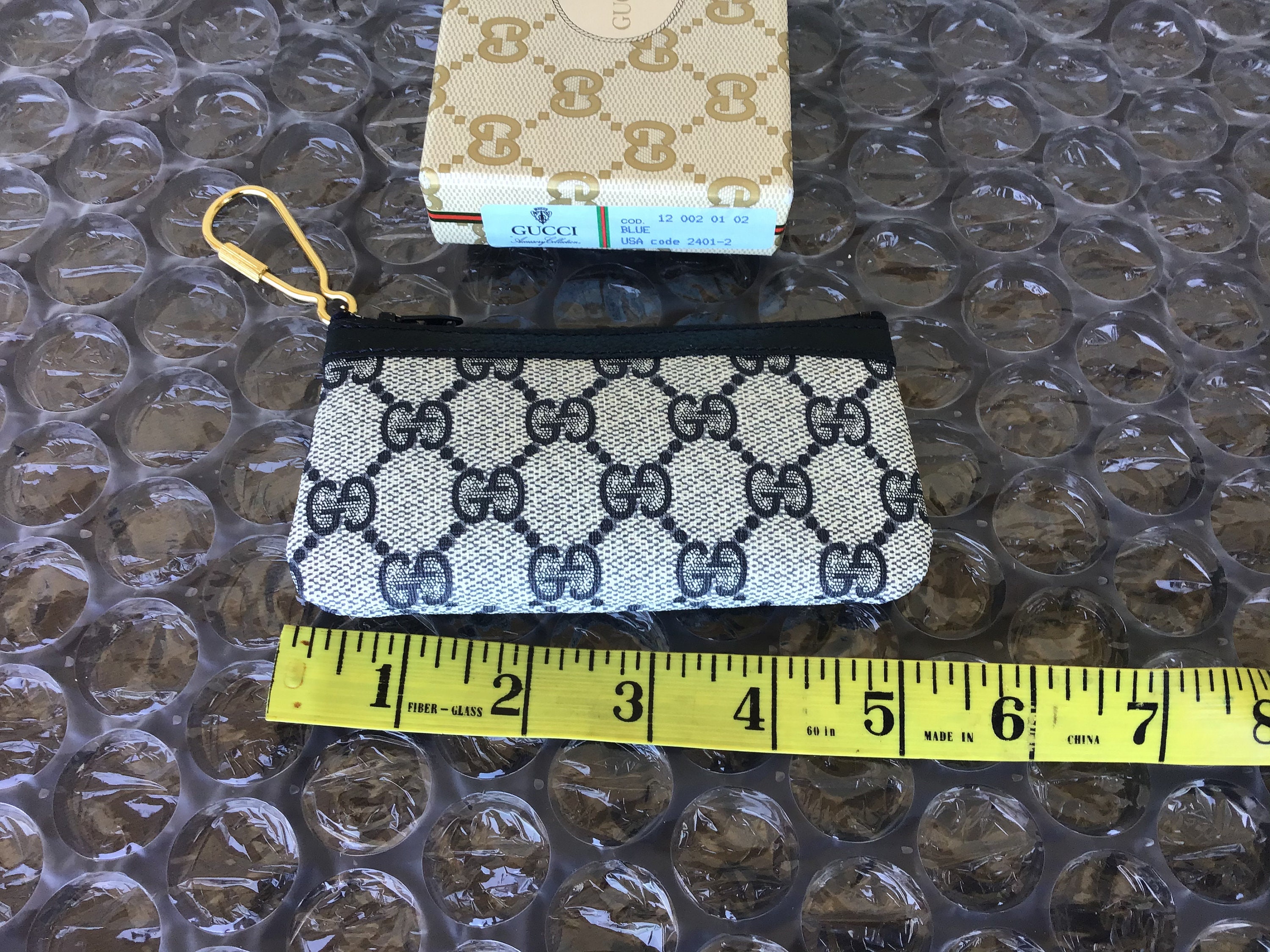 GG Marmont keychain wallet in black leather | GUCCI® US