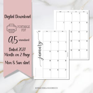 Puede incluir: Descarga digital PDF imprimible A5 estándar con fecha de 2027, calendario mensual en 2 páginas. El calendario presenta una pancarta rosa con texto y un fondo blanco con detalles dorados. Se muestra el calendario de enero.