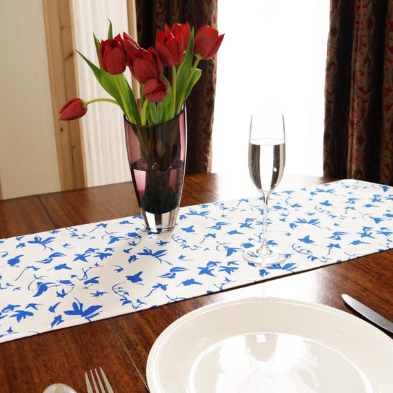 Table runner in linen with screen printed ivy design, washable with hemmed edge 215 x 32cm. Created and made by Curious Lions in the UK.