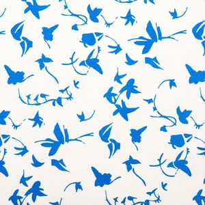 May include: A white fabric featuring a repeating pattern of scattered, vibrant blue abstract floral and leaf shapes. The design consists of various organic silhouettes, including small sprigs, individual petals, and leafy stems, all printed in a solid, bold blue color against a clean, plain white background.