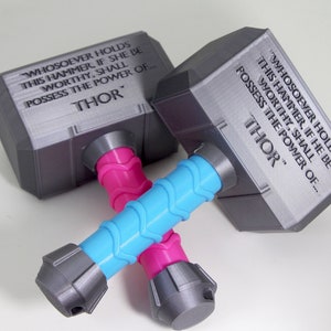 Thor Hammer Baby Rattle also known as a Mjolnir. Great for cosplay, baby toy or a gift for baby. Perfect for Avengers fans or office decor.