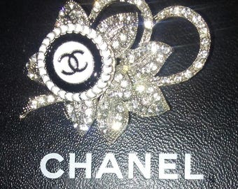 Chanel white Vintage Rhinestone Flower and Chanel button brooch