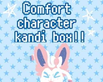 May include: A pink and blue cartoon character with large ears and a bow tie on a blue background with white stars. The text "Comfort character kandi box!" is written in white pixelated letters.