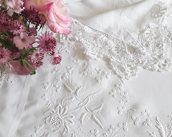 Vintage linen tablecloth with whitework embroidery and an Irish crochet trim. Hand made Irish crocheted lace