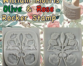 Puede incluir: Dos sellos de goma grises con un diseño floral. El diseño presenta ramas de olivo y rosas. Los sellos están etiquetados como "William Morris Olive & Rose Rocker Stamp".