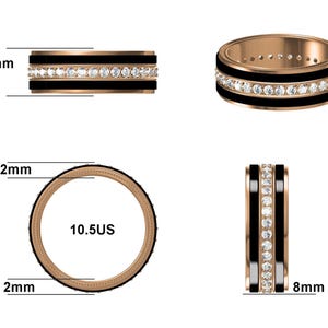 May include: A rose gold ring with a black band and a row of clear gemstones. The ring is 8mm wide and is a size 10.5 US. The ring's band is 2mm thick.