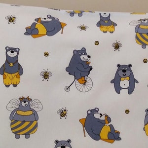 May include: White pillowcase with a repeating pattern of gray bears wearing yellow clothing and riding bicycles, holding honey pots, and wearing bee wings. The background is white with yellow bees and honeycombs.