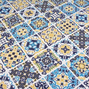May include: A repeating pattern of blue, yellow, and white tiles with intricate designs. The tiles are arranged in a grid pattern.