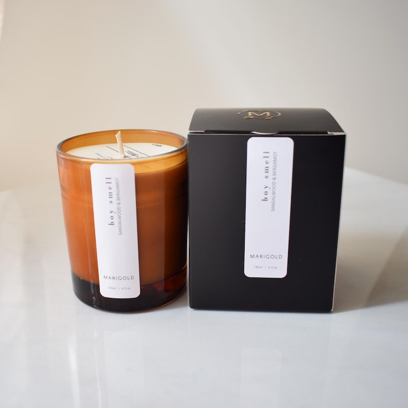 sandalwood and bergamot candle in amber jar with  box