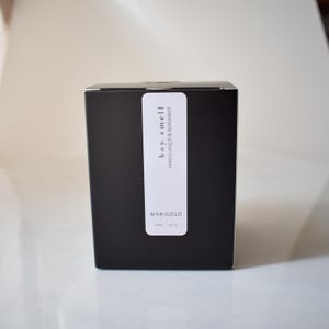 sandalwood and bergamot candle in amber jar box
