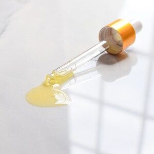 Marigold Charms Bakuchiol Face Serum dropper
