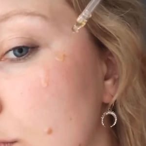 Marigold Charms Bakuchiol Face Serum on face