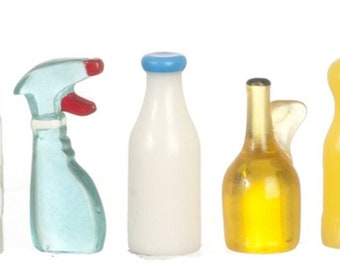 May include: A collection of miniature bottles, including a clear bottle with a white cap, a blue spray bottle with a red nozzle, a white bottle with a blue cap, a gold bottle, and a yellow bottle with a white cap.