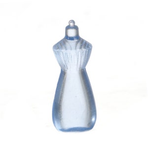 May include: A small, light blue dress form figurine. The miniature dress form is made of a translucent material and has a detailed bodice and a flared skirt. The figurine is standing upright against a white background.