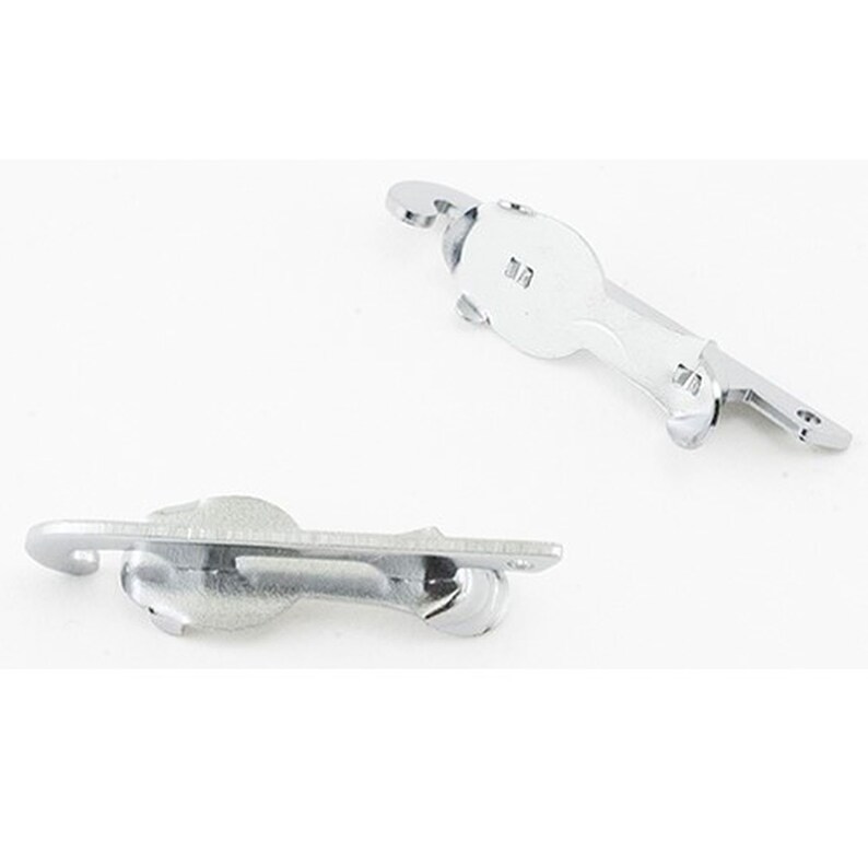 May include: Two shiny, silver-colored metal latches. Each latch has a curved hook, a rounded body, and a flat, rectangular base with screw holes. The latches are designed for securing doors or other closures.