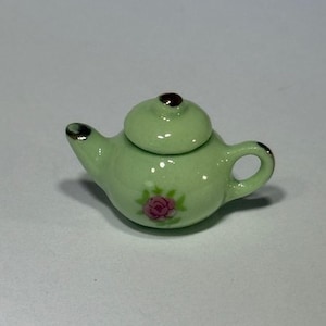 May include: A white ceramic mug with a black handle and the text "But First, Coffee" in a handwritten style. The mug is likely 11-15 ounces, perfect for a morning beverage.