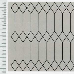 May include: A black geometric pattern on a gray background. The pattern consists of connected diamond and elongated diamond shapes. A ruler with inch measurements is on the left side of the image.