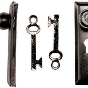 May include: Antique-style door hardware set in a dark, aged finish. The set includes a door knob, two keys, and a keyhole plate. The hardware has a vintage aesthetic, with detailed designs and a classic look.