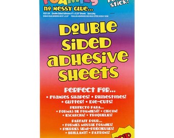 May include: A package of Darice Foamies double-sided adhesive sheets. The package is primarily red, orange, and yellow, with the words "Double Sided Adhesive Sheets" in large yellow letters. The package also says "Just Peel & Stick!"