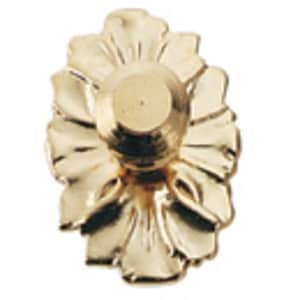 May include: A gold-colored, decorative furniture knob with a floral design. The knob features a central, rounded element surrounded by stylized petals. The finish is shiny and reflective, suggesting a brass or similar metal.
