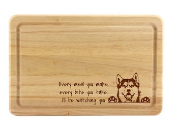 May include: A wooden chopping board with the text "Every meal you make, every bite you take, I'll be watching you" and a husky dog illustration.