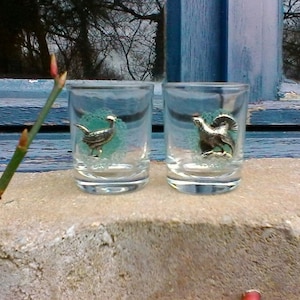 A pair of lovely little French vintage liqueur glasses decorated with metal birds