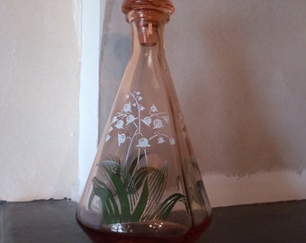 A beautiful French vintage pink glass liqueur decanter decorated with lily of the valley - muguet