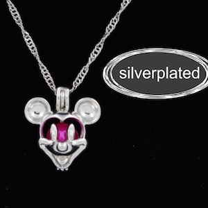 May include: Silver-plated necklace with a Mickey Mouse charm. The charm has a pink nose and black eyes.
