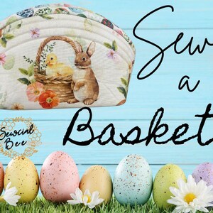 May include: A white fabric basket with a floral pattern and a bunny and chick design. The basket is shaped like a half-circle and has a handle. The text "Sew a Basket" is written in black on a blue background. The text "Sewcial Bee" is written in gold on a honeycomb pattern.