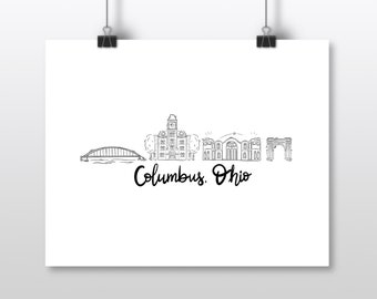 May include: A black and white line drawing of the Columbus, Ohio skyline. The image includes a bridge, buildings, and an arch, with the city name in cursive script below. The artwork is printed on white paper and held by binder clips.